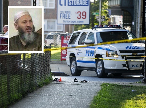 Sandals lay on a street corner at the crime scene, Saturday, Aug. 13, 2016, not far from the Al-Furqan Jame Masjid Mosque in the Ozone Park neighborhood of Queens, New York, where the leader of a New York City mosque has been fatally shot and an associate has been wounded in a brazen daylight attack. (AP Photo/Craig Ruttle)