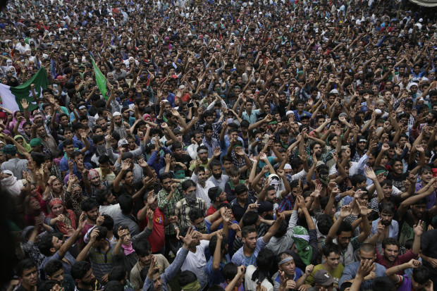 Kashmiris shout pro freedom slogans during a joint funeral of four civilains at Aripanthan village, west of Srinagar, Indian controlled Kashmir, Tuesday, Aug.16, 2016. Government forces in Indian-controlled Kashmir shot and killed four civilians and injured at least 15 others Tuesday as clashes intensified with anti-India protesters in the troubled region, police said. (AP Photo/Mukhtar Khan)