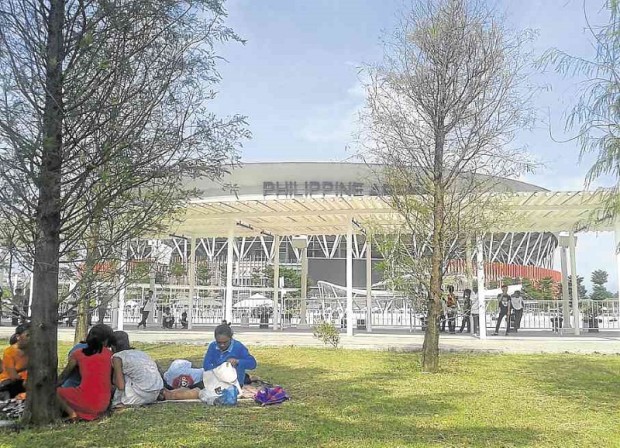 VISITORS picnic on the grounds of Philippine Arena in Bulacan province, which is now the new home of the University of the Philippines’ track team. CONTRIBUTED PHOTO