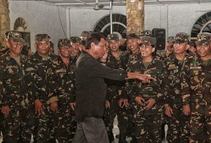 In this Aug. 6, 2016 file photo, President Rodrigo Duterte tells soldiers of the Armed Forces of the Philippines at Camp Lapu-Lapu in Cebu, he's working on increasing soldiers' pay and benefits.  The President wants to tap the help of the AFP in the war on drugs.  (CDN FILE PHOTO/TONEE DESPOJO)