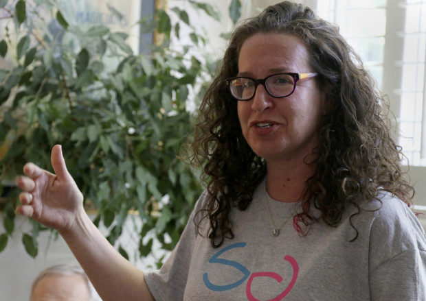 'Support the Girls' founder Dana Marlowe talks to volunteers during the non-profit organization's official launch party on Thursday, July 21, 2016, at her home in Silver Spring, Md. The organization collects and donates bras and feminine hygiene products to women and girls around the country. Marlowe jokingly calls herself an 'accidental activist' and works on the 'Support the Girls' initiative in her off hours. (AP Photo/Vanessa A. Alvarez)