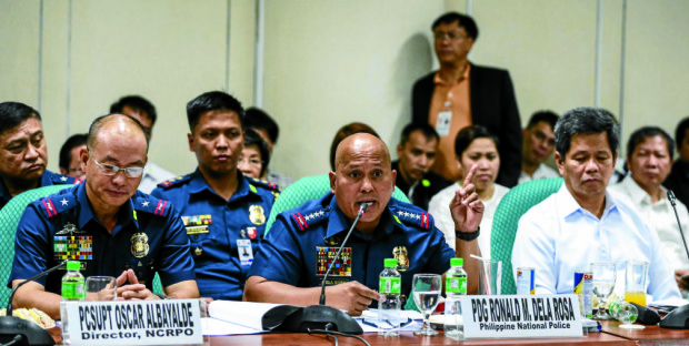  PNP chief Director General Ronald dela Rosa addresses Sen. Leila de Lima at the hearing of the Senate Committee on Public Order and Dangerous Drugs/Civil Service, etc. chaired by Sen. Panfilo Lacson. Beside him are Dangerous Drugs Board Sec. Felipe Rojas (R) and PCSupt Oscar Albayalde (L). INQUIRER PHOTO/LYN RILLON