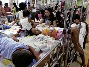 Children who have fallen ill with dengue fever share hospital beds at a government hospital. (INQUIRER FILE PHOTO)