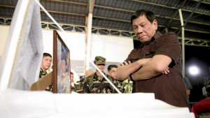 PRESIDENT Duterte pays his respects at the wake of one of the four soldiers killed by the NPA. MALACAÑANG PHOTO