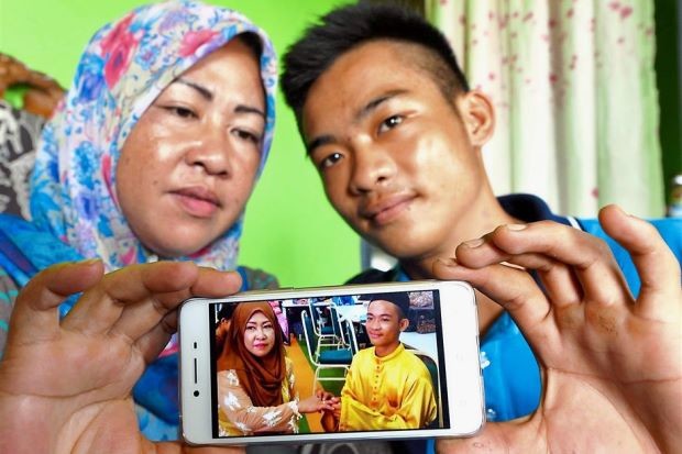 Happy couple: Sufie and Dayang Sopiah showing their engagement picture. PHOTO FROM THE STAR ONLINE/ASIA NEWS NETWORK