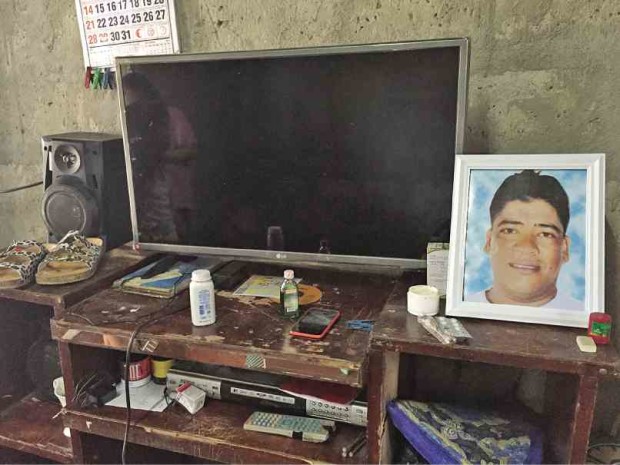 SUDDENLY BLACK In an instant, Lamberto Rodriguez’s family lost a father in a predawn attack on their Muntinlupa City home. His portrait now sits in a place that is impossible to miss at the grief-stricken household.  ANNELLE TAYAO-JUEGO 
