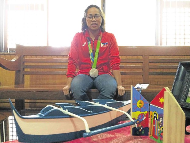 TAKING A PRECIOUS BREATHER  Hidilyn Diaz relaxes at a waiting lounge at the mayor’s office in Zamboanga City. JULIE ALIPALA / INQUIRER MINDANAO