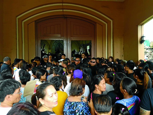 Well-wishers filled the Immaculate Conception Parish Church In Tanza in Iloilo City where a Mass was held for slain suspected drug lord Melvin Odicta and wife Meriam (Photo by Nestor P. Burgos Jr./INQUIRER VISAYAS)