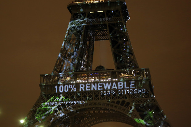 FILE- In this Sunday, Nov. 29, 2015 file photo, an artwork entitled 'One Heart One Tree' by artist Naziha Mestaoui is displayed on the Eiffel tower ahead of the 2015 Paris Climate Conference, in Paris. At least 20 countries are expected to formally join the Paris Agreement on climate change this week, greatly improving the pact’s chances of coming into force just a year after it was negotiated in the French capital, U.N. officials say.  (AP Photo/Thibault Camus, File)
