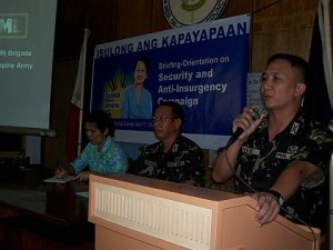 In this 2012 file photo, Colonel Erwin Bernard Neri, then a lieutenant colonel,  is seen at right, speaking at the podium during a counter-insurgency seminar in Negros Oriental. (Photo from the archives of Philippine Information Agency-Dumaguete or PIA Dumaguete at  http://archives.pia.gov.ph/?m=1&t=2&fi=080418-r7-orientation.jpg&mo=0804  )