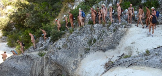 A group of naturist people take part in a hike along the Aiguillon riverbed on July 26, 2012 near Lussan, eastern France. Tired of staying in nudist camps, some naturists go hiking as another experience to be at one with nature.   AFP PHOTO/PHILIPPE DESMAZES / AFP PHOTO / PHILIPPE DESMAZES