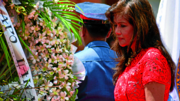 GOLDEN STATUE Ilocos Norte Gov. Imee Marcos leads the wreath-laying ceremony at the golden statue of her father, the late strongman Ferdinand Marcos, in Sarrat town, his birthplace. EV ESPIRITU / INQUIRER NOTHERN LUZON