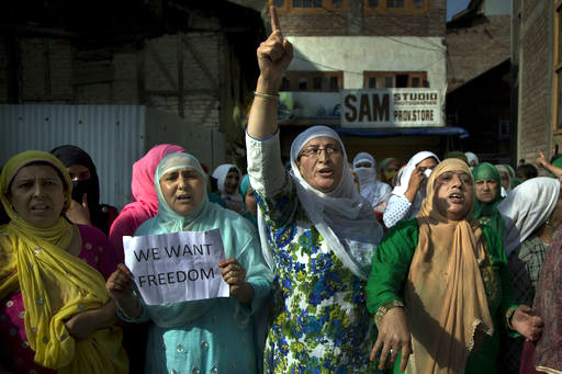 Kashmiri Muslim women shout freedom slogans during a protest after Eid al-Adha prayers in Srinagar, Indian controlled Kashmir, Tuesday, Sept. 13, 2016. Security forces fired tear gas and shotgun pellets to quell protesters in several places, as a security lockdown marred Eid festivities in the troubled region. AP