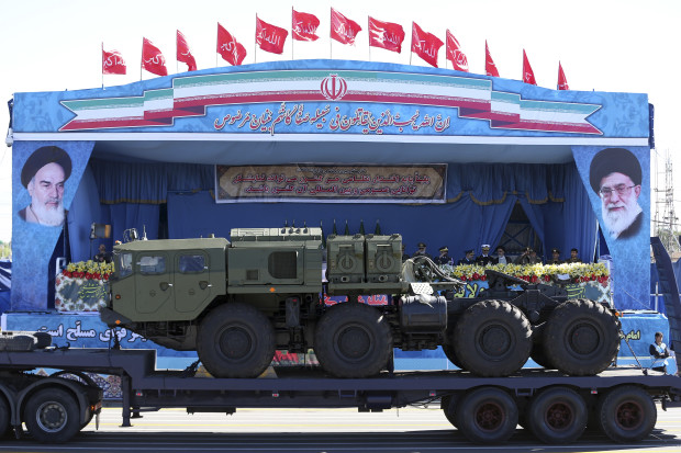 FILE -- In this April 17, 2016 file photo, a long-range S-300 missile system is displayed by Iran's army during a parade marking National Army Day, in Tehran, Iran. State media says the military has begun deploying a Russia-supplied S-300 air defense system around the underground Fordo nuclear facility. Video footage posted late Sunday, Aug. 28, 2016, on Iranian state TV’s website showed trucks arriving at the site and missile launchers being aimed skyward. Russia began delivering the S-300 system to Iran earlier this year after sanctions were lifted under a landmark nuclear agreement with world powers. (AP Photo/Ebrahim Noroozi, File)
