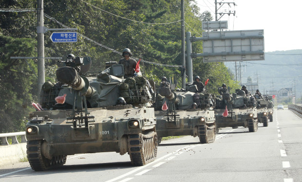 South Korea's army K-9 self-propelled artillery vehicles move during an exercise in Paju, South Korea, near the border with North Korea, Monday, Sept. 5, 2016. North Korea on Monday fired three suspected medium-range missiles that traveled about 1,000 kilometers (620 miles) and landed near Japan in an apparent show of force timed to coincide with the G-20 economic summit in China, South Korean officials said. (AP Photo/Ahn Young-joon)