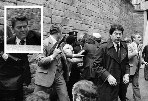 Secret Services agents and police swarm John Hinckley Jr. seconds after he shot then-President Ronald Reagan (inset) outside the Washington Hilton hotel on March 30, 1981. AP FILE