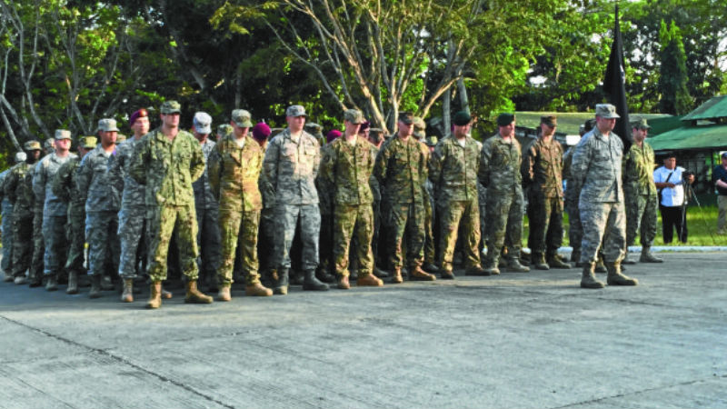 ZAMBOANGA MISSION About 50 US soldiers on formation witness the ceremonial folding of the flag of the Joint Special Operations Task Force Philippines at the Western Mindanao Command grandstand in Zamboanga City in this photo taken in February 2015. President Duterte has said American forces are magnets of terrorist attacks in Mindanao. JULIE ALIPALA/INQUIRER MINDANAO