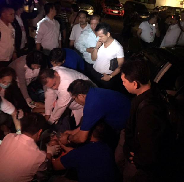 Samar Rep. Edgar Sarmiento looks worried while medics try to revive his driver Robert Dela Cruz, 40, who was found unconscious in a locked car after session adjourned Wednesday night. Sarmiento believes his driver was suffocated while sleeping inside the vehicle. PHOTO/ Marc Jayson Cayabyab, INQUIRER.net