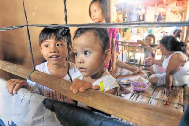 MANOBO children, removed from their communities in Lianga, Surigao del Sur province, find a temporary home at the province’s sports center. CHRIS V. PANGANIBAN/INQUIRER MINDANAO