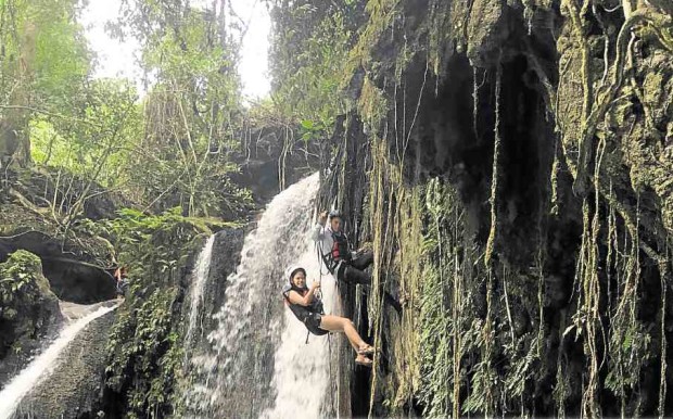 EXTREME sports enthusiasts can enjoy waterfall rappelling at the iconic Kawasan Falls in Badian, southern Cebu province.  JOE SANTINO BUNACHITA