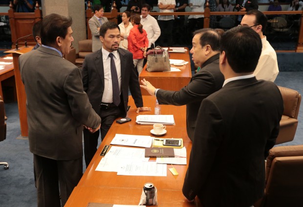 SENATE SESSION / SEPTEMBER 19, 2016 Senator Richard Gordon huddles with fellow senators after emerging from a caucus to continue their deliberation in ousting Senator Leila De Lima as the chairman of the Committee on Human Rights and Justice on Monday, September 19, 2016.  Senator Gordon was voted by the senators to replace Senator De Lima. INQUIRER PHOTO / GRIG C. MONTEGRANDE