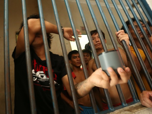 Trisikad driver Carl John Sacal is put behind bars after he allegedly made a bomb joke inside a Cebu mall. CEBU DAILY NEWS PHOTO
