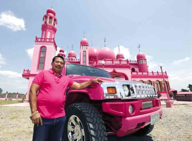 COLOR OF LOVE Samsudin Dimaukom, mayor of Datu Saudi Ampatuan, in a pink shirt with his pink Hummer and the pink mosque in the background. It痴 the color of love and peace, he said. RAFFY LERMA