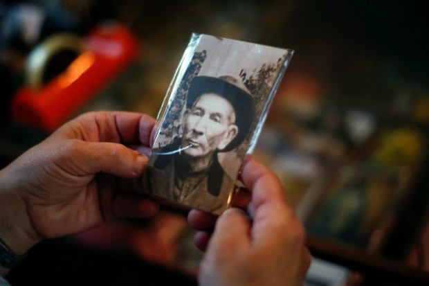 A person holds a picture of the Blessed Jose Gabriel Brochero also known as "Cura Gaucho", at the museum of the Nuestra Senora del Transito sanctuary, in Villa Cura Brochero, Argentina, on September 20, 2016.   The Cura Gaucho will be canonized by Pope Francis next October 16 in Rome. / AFP PHOTO / DIEGO LIMA