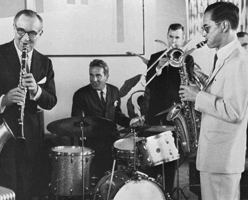 FILE - In this July 5, 1960, file photo, Thailand's King Bhumibol Adulyadej, right, plays the saxophone during a jam session with legendary jazz clarinetist Benny Goodman, left, drummer Gene Krupa, second left, and trombonist Urbie Green in New York. Thailand's Royal Palace said on Thursday, Oct. 13, 2016, that Thailand's King Bhumibol Adulyadej, the world's longest-reigning monarch, has died at age 88. (Bureau of the Royal Household via AP, File)