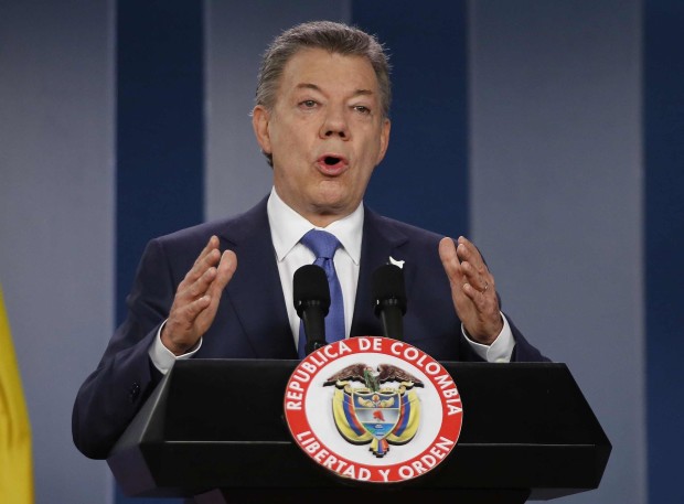 FILE - In this Wednesday, Oct. 4, 2016 file photo Colombia’s President Juan Manuel Santos delivers a statement to the press after meeting with former President Alvaro Uribe and other opposition leaders at the presidential palace in Bogota, Colombia. Colombian President Juan Manuel Santos has won Nobel Peace Prize it was announced on Friday Oct. 7, 2016.  (AP Photo/Fernando Vergara, File)