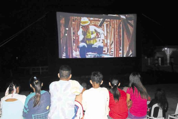 MOVIE NIGHT Compostela Valley residents enjoy an open-air screening of a local film. CONTRIBUTED PHOTO