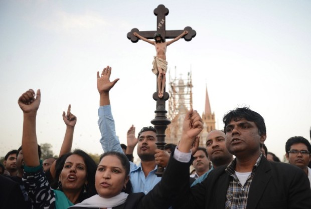 Pakistani Christians shout slogans during a protest against the attack on the homes of members of the Christian community by Muslim demonstrators, in Karachi on March 9, 2013. Thousands of angry protestors on March 9 set ablaze more than 100 houses of Pakistani Christians over a blasphemy row in the eastern city of Lahore, officials said. Over 3,000 Muslim protestors turned violent over derogatory remarks allegedly made by a young Christian, Sawan Masih, 28 against Prophet Muhammad in a Christian neighboorhood in Badami Bagh area. AFP PHOTO/ ASIF HASSAN / AFP PHOTO / ASIF HASSAN