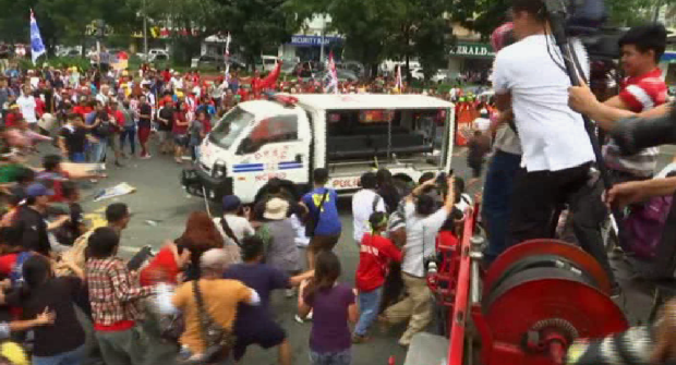 A police patrol car rammed the protesters and ran over some at an anti-US rally outside the US embassy. SCREENGRAB FROM AP VIDEO