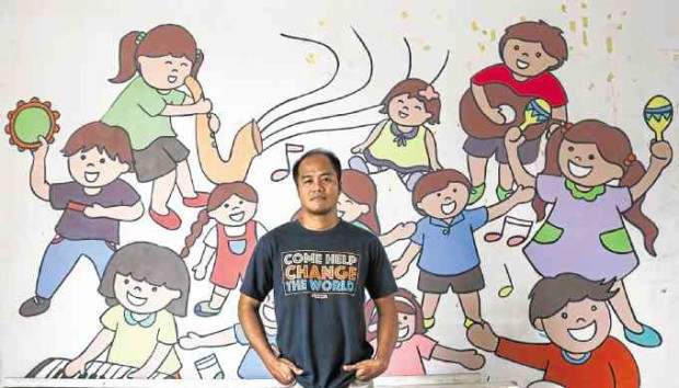 Music teacher Ferdinand Medina is also a community worker who hopes to “level the playing field.”