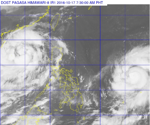 The Philippines sits in the middle of two typhoons as Typhoon 'Karen' (left) swirls away from the country and Typhoon 'Haima' crawls closer on the lower right. Haima is forecast to enter the Philippine area of responsibility Monday afternoon or evening. PAGASA PHOTO