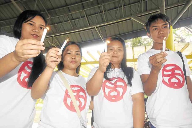 Young Marcos loyalists wear T-shirts with the logo of Kabataang Barangay, a youth group formed during the Marcos dictatorship.  —WILLIE LOMIBAO 