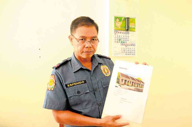 Albuera police director Chief Insp. Jove Espenido shows a drawing of the proposed drug rehabilitation center that would rise inside the residential compound of Mayor Rolando Espinosa Sr. —ROBERT DEJON