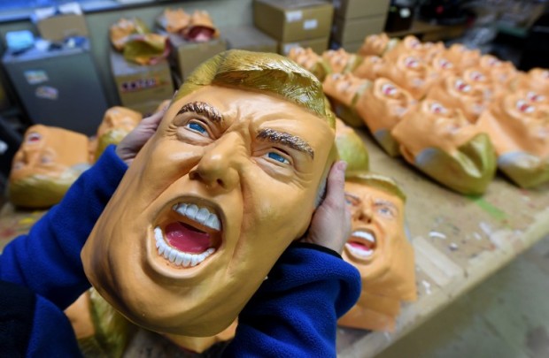 This picture taken on November 22, 2016 shows ann employee displaying a rubber mask of US President-elect Donald Trump at the Ogawa Studios mask factory in Saitama, north of Tokyo.  The jury is still out on what Donald Trump's election victory means for close US ally Japan. But at least one local business has emerged a winner. Ogawa Studios, the country's top rubber mask maker, has seen surging demand for their version of the billionaire real-estate magnate since his shock November 8 win. AFP