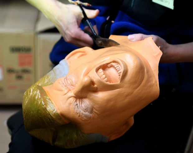 This picture taken on November 22, 2016 shows an employee producing a rubber mask of US President-elect Donald Trump at the Ogawa Studios mask factory in Saitama, north of Tokyo.  The jury is still out on what Donald Trump's election victory means for close US ally Japan. But at least one local business has emerged a winner. Ogawa Studios, the country's top rubber mask maker, has seen surging demand for their version of the billionaire real-estate magnate since his shock November 8 win. AFP