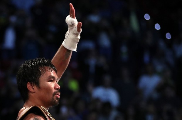 LAS VEGAS, NV - NOVEMBER 05: Manny Pacquiao of the Philippines celebrates after his unanimous-decision victory over Jessie Vargas at the Thomas & Mack Center on November 5, 2016 in Las Vegas, Nevada. Pacquiao won the WBO welterweight championship.   Christian Petersen/Getty Images/AFP