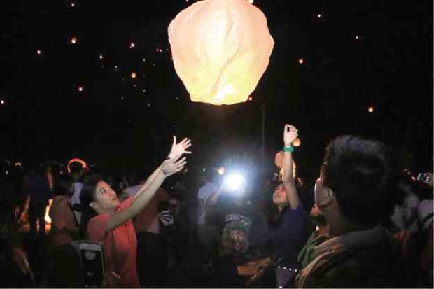 Debris from lanterns released during an event in Alaminos have worried environmentalists. —RAMIL RAPUES/CONTRIBUTOR 