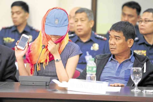 TELLING VIBER MESSAGES  Hannah Mae, daughter of Ronnie Dayan,  shows lawmakers a purported Viber message  from Sen.  Leila de Lima on Oct. 1 telling her father not to appear in the House committee  investigation. — JOAN BONDOC