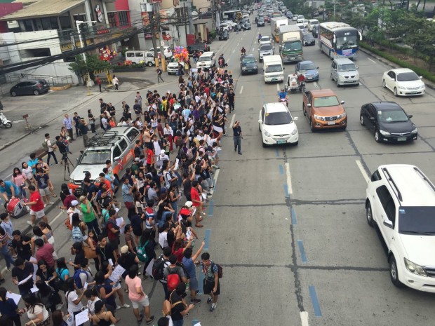 Ateneo de Manila University students walk out of their classes and join protests along Katipunan against the burial of former president Ferdinand Marcos at the Libingan ng mga Bayani. Photo by Joan Bondoc/INQUIRER