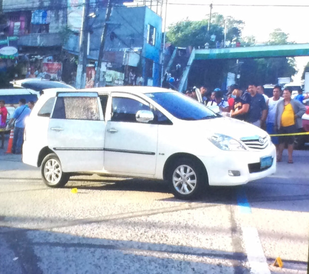 The bullet-riddled car of BIR Makati Office director Jonas Amora in Quezon City (PHOTO BY JODEE AGONCILLO/ INQUIRER)