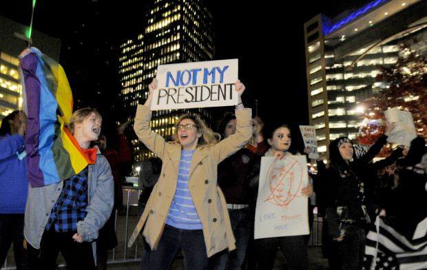 Protesters Donald Trump's presidential election march around Campus Martius Park, Wednesday Nov. 9, 2016, in Detroit. A day after Trump's election to the presidency, campaign divisions appeared to widen as many thousands of demonstrators flooded streets across the country to protest his surprise triumph. AP