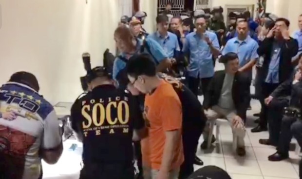 Kerwin Espinosa, allegedly the biggest drug lord in Eastern Visayas, undergoes booking procedures at Camp Crame. Screen capture from PNP PIO video.