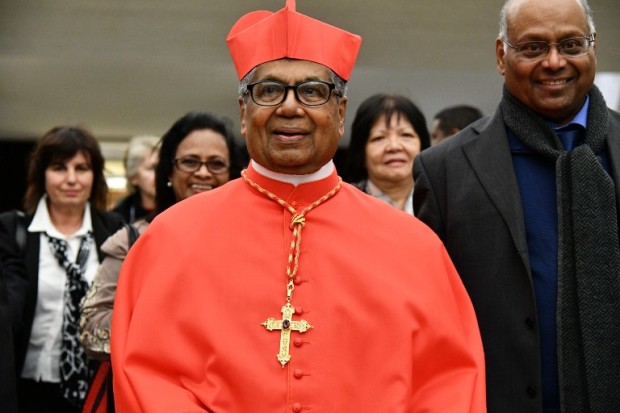Newly elevated cardinal, archbishop of Kuala Lumpur in Malaysia, Anthony Soter Fernandez, arrives for a courtesy visit with relatives following a consistory on November 19, 2016 at the Paul VI audience hall in Vatican. Pope Francis created 17 new cardinals from across the globe Saturday, elevating them in a time-honoured ceremony to an elite body that advises and elects popes. Three of them are from the US, while others come from corners of the world where the Catholic Church needs a boost.  / AFP PHOTO / VINCENZO PINTO