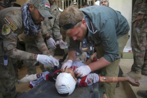 Medics treat boy injured in Baghdad car bombing 24 Nov 2016