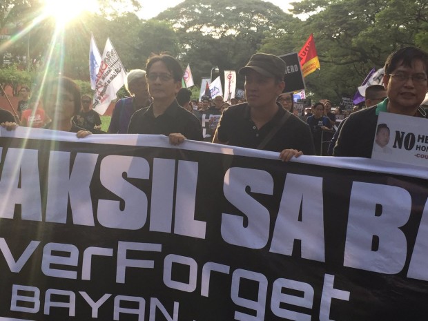 UP Chancellor Michael Tan and Bayan Secretary General Renato Reyes lead protest groups converging inside the campus. Photo by Marc Jayson Cayabyab/INQUIRER.net