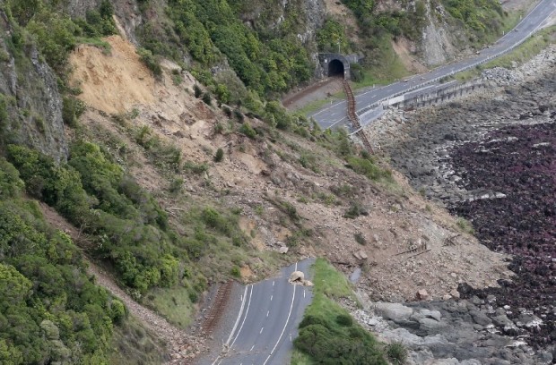 This aerial photo taken and received on November 14, 2016 shows earthquake damage to State Highway One near Ohau Point on the South Island's east coast. A powerful 7.8-magnitude earthquake killed two people and caused massive infrastructure damage in New Zealand, but officials said on November 14 they were optimistic the death toll would not rise further.  The jolt, one of the most powerful ever recorded in the quake-prone South Pacific nation, hit just after midnight near the South Island coastal town of Kaikoura. / AFP PHOTO / POOL / Mark MITCHELL